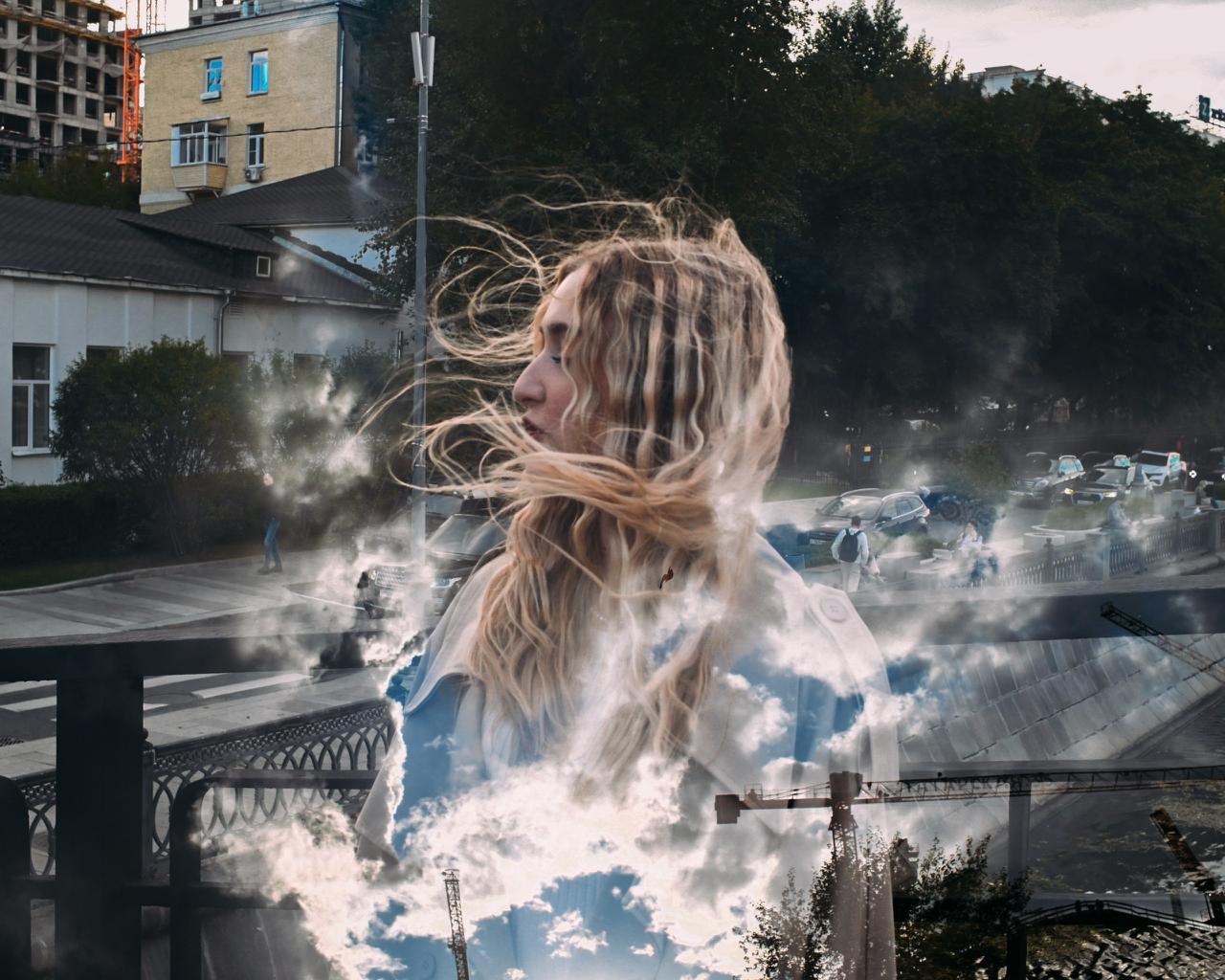 Thoughtful woman against a double-exposure cityscape, representing women’s emotional needs in a relationship